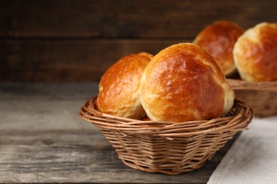 Freshly baked soda water scones on wooden table, closeup. Space for text