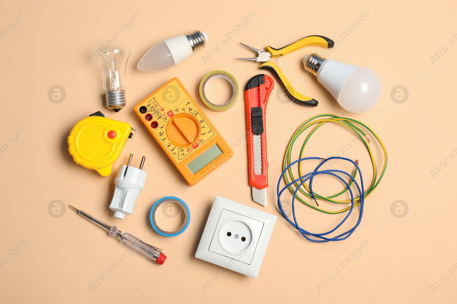 Photo of Electrician's tools on color background, top view