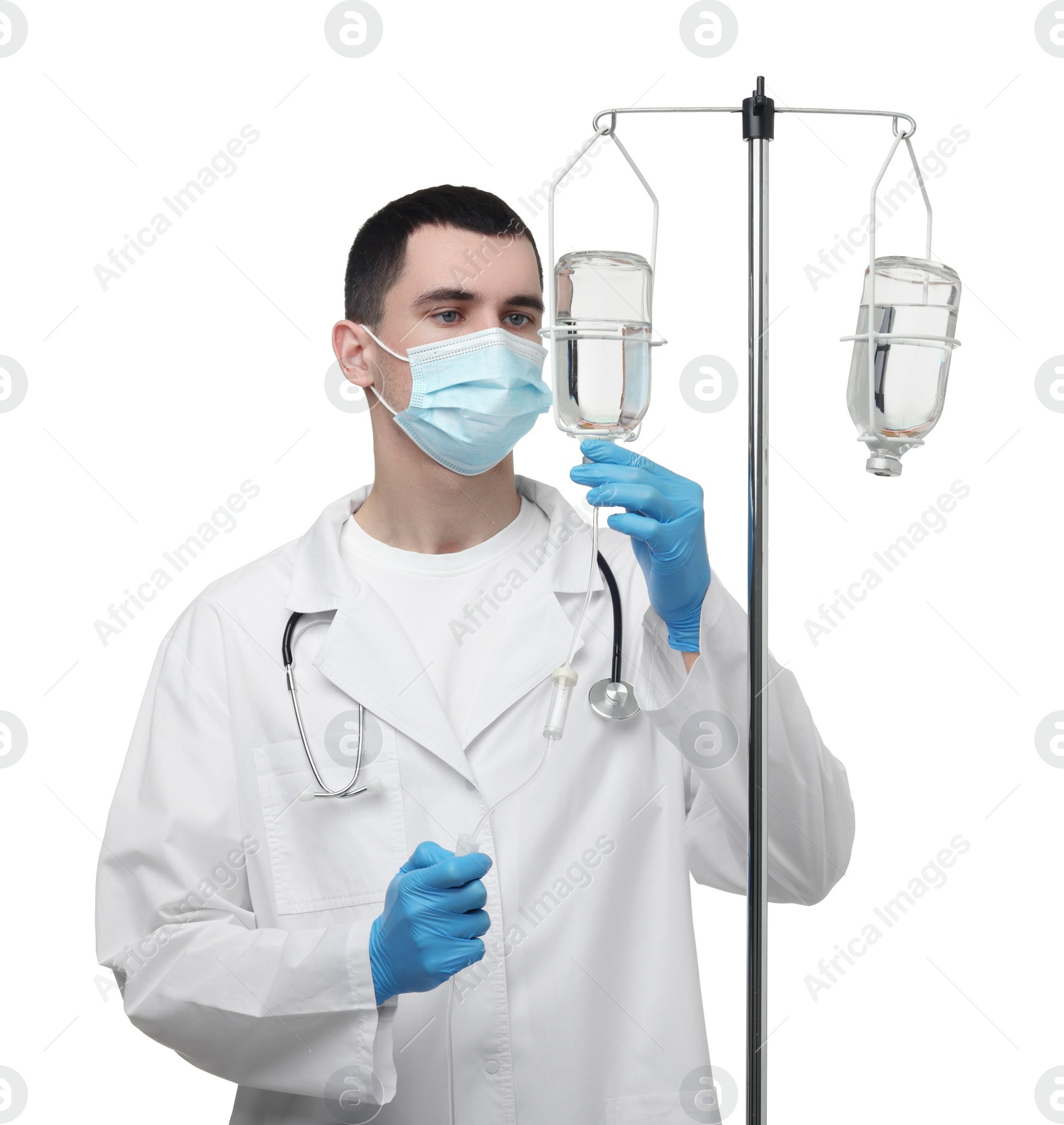 Photo of Doctor setting up IV drip on white background