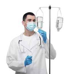 Doctor setting up IV drip on white background