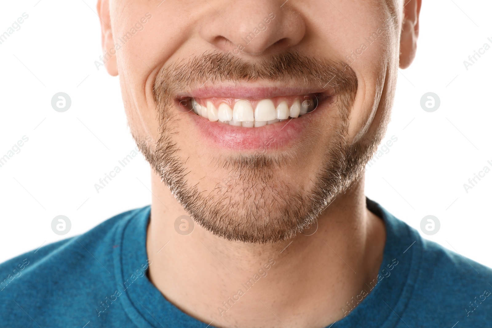 Photo of Smiling man with perfect teeth on white background, closeup