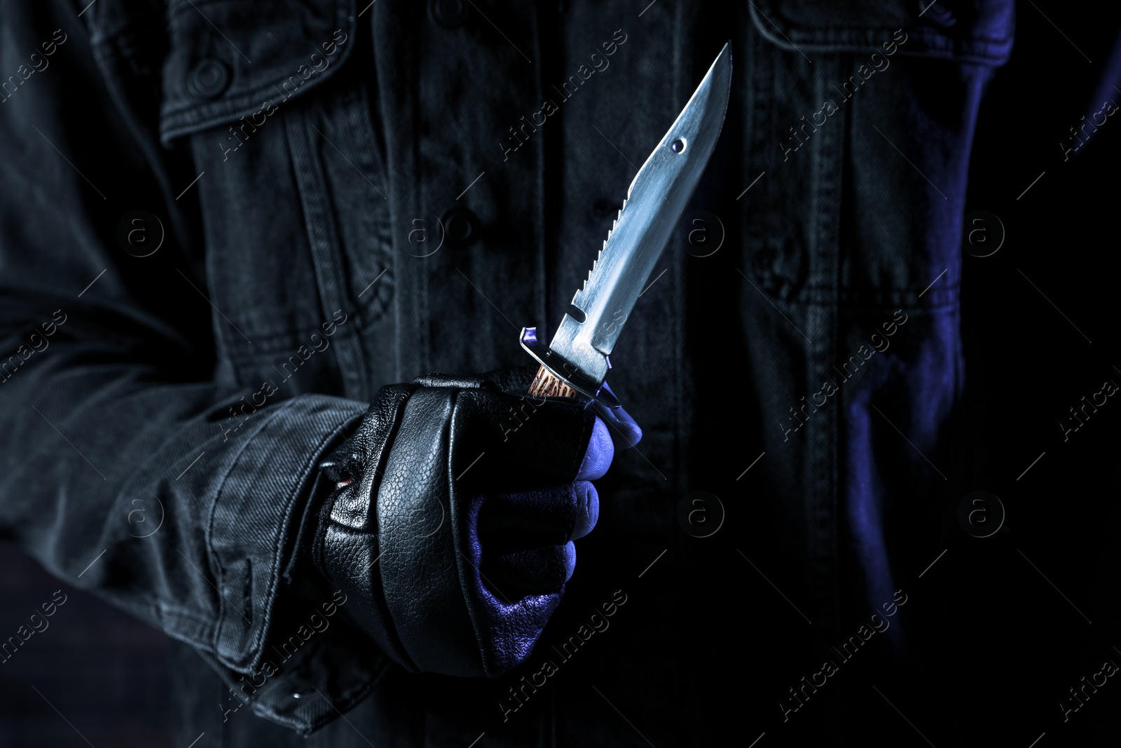 Photo of Man with knife, closeup view. Dangerous criminal