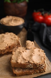 Fresh bread with delicious meat pate served on black table, closeup