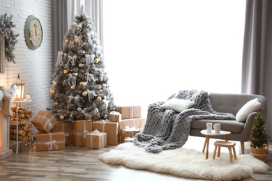 Photo of Stylish interior of living room with decorated Christmas tree