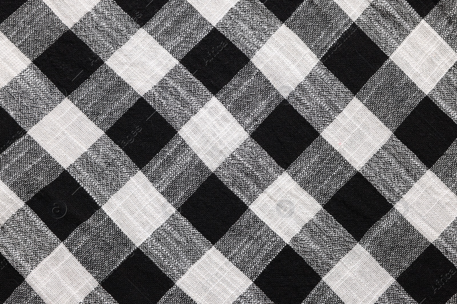 Photo of Black checkered tablecloth as background, top view