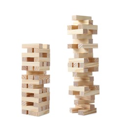 Image of Jenga towers of wooden blocks on white background