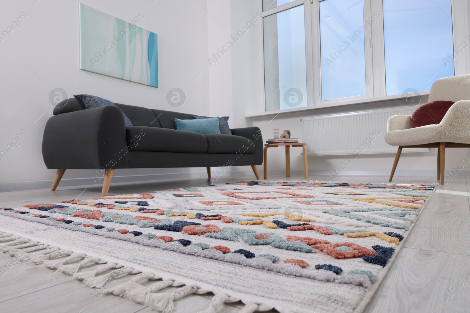 Photo of Living room with beautiful carpet and furniture, low angle view