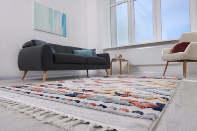 Living room with beautiful carpet and furniture, low angle view