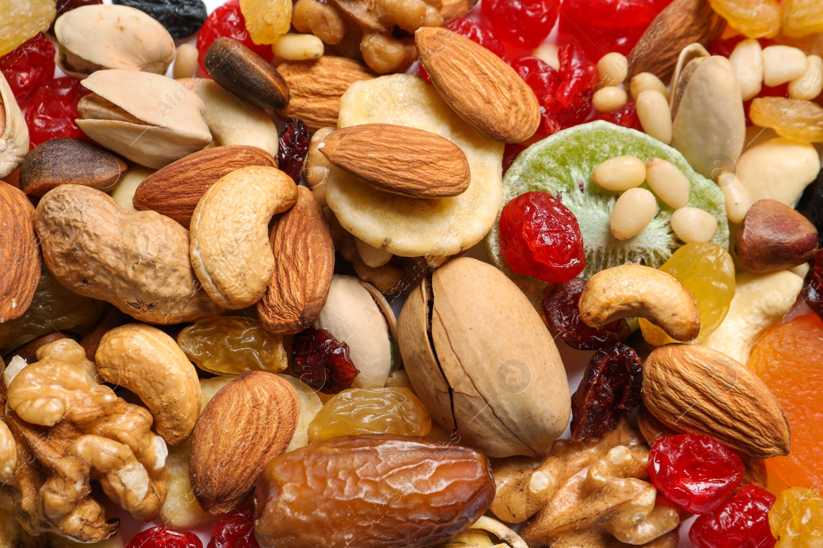 Photo of Different dried fruits and nuts as background, closeup