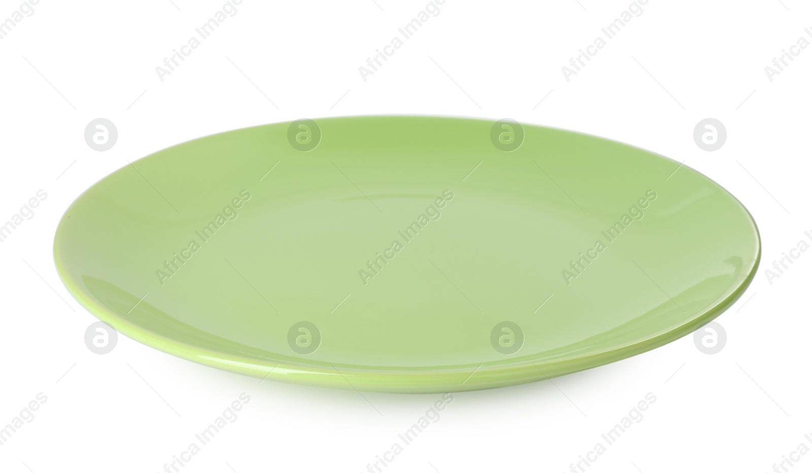 Photo of One beautiful green plate isolated on white