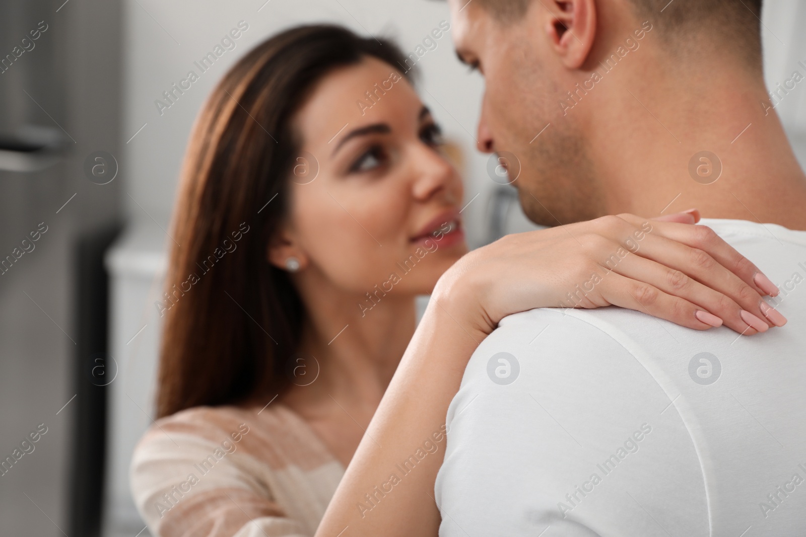 Photo of Happy young couple dancing together at home, focus on hand