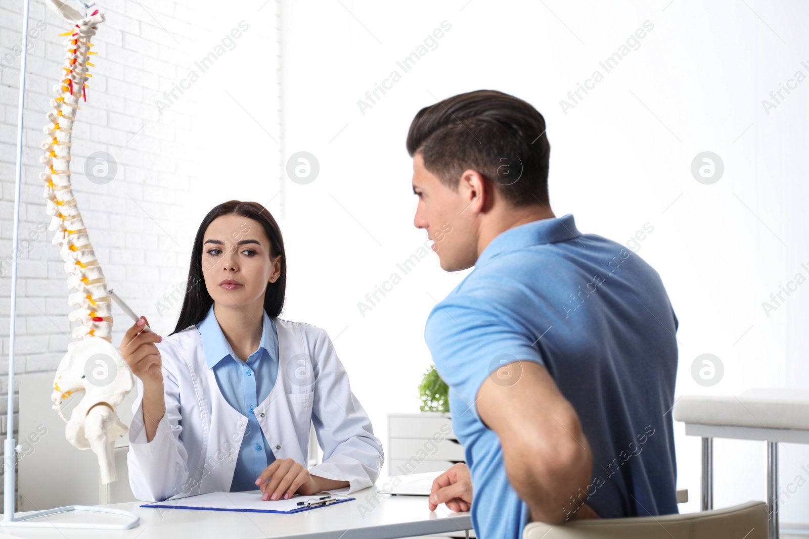 Photo of Man visiting professional orthopedist in medical office