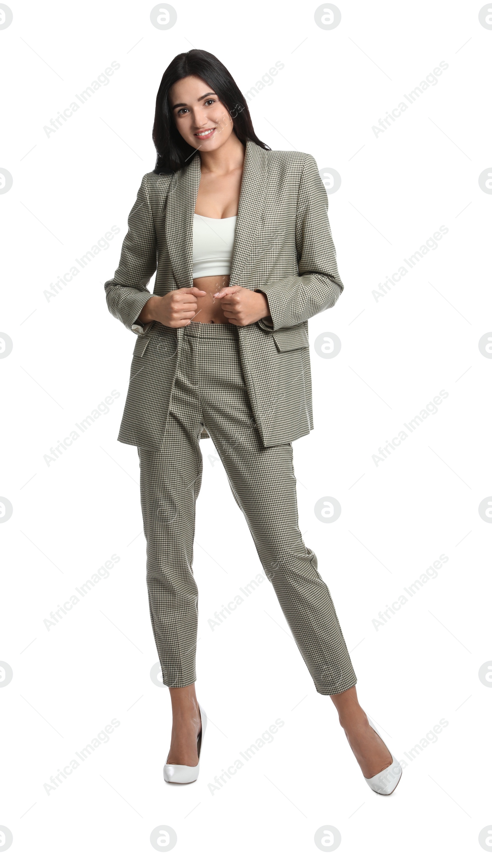 Photo of Full length portrait of beautiful woman in formal suit on white background