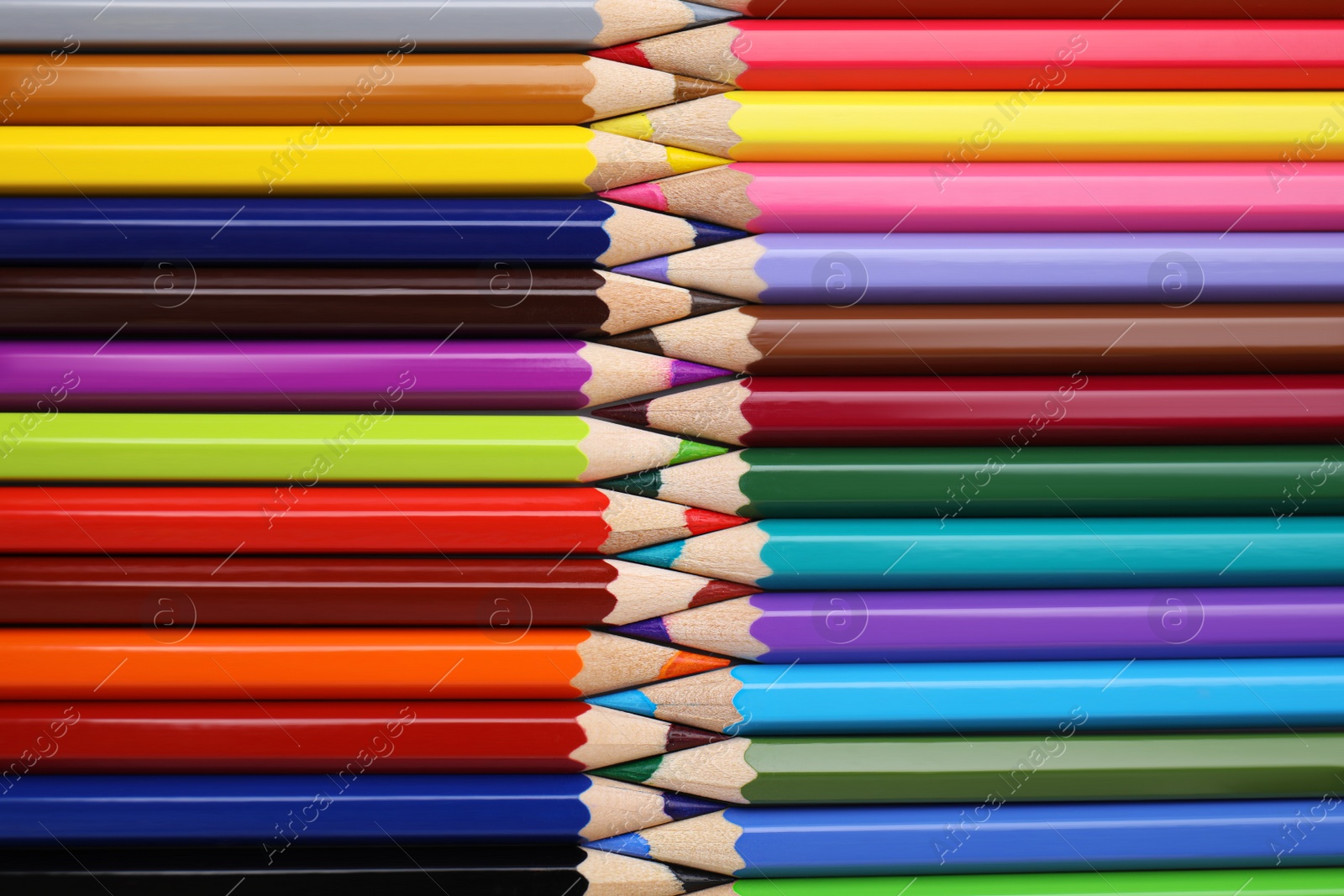 Photo of Many colorful wooden pencils as background, top view