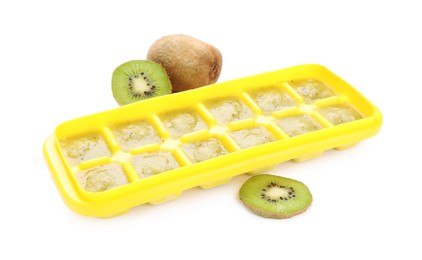 Photo of Kiwi puree in ice cube tray and fruits on white background. Ready for freezing
