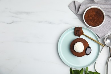 Photo of Delicious fresh fondant with hot chocolate and ice cream on white marble table, flat lay. Space for text
