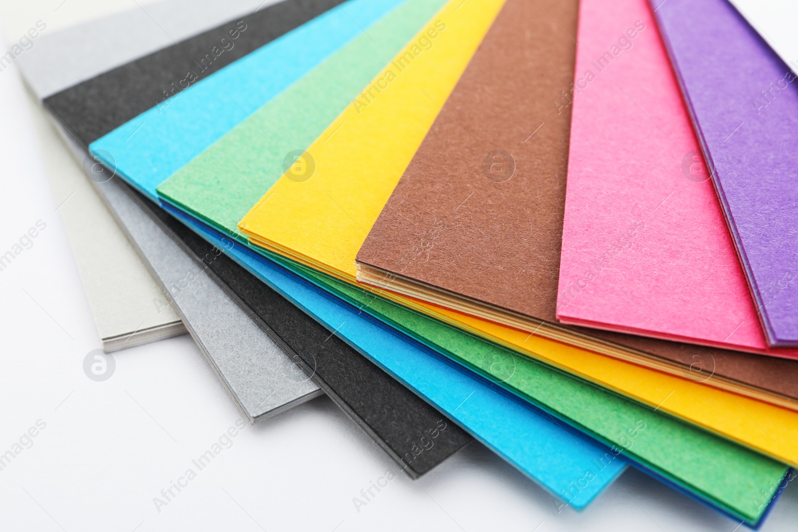 Photo of Color palette samples on white background, closeup