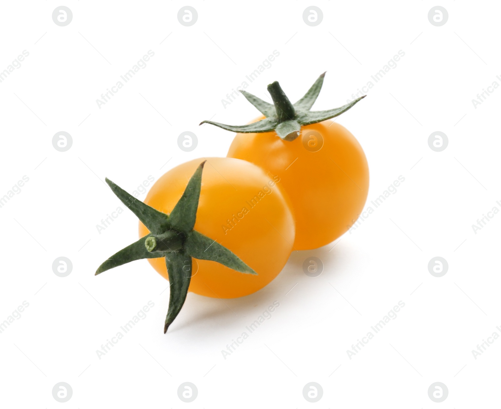 Photo of Ripe yellow cherry tomatoes on white background