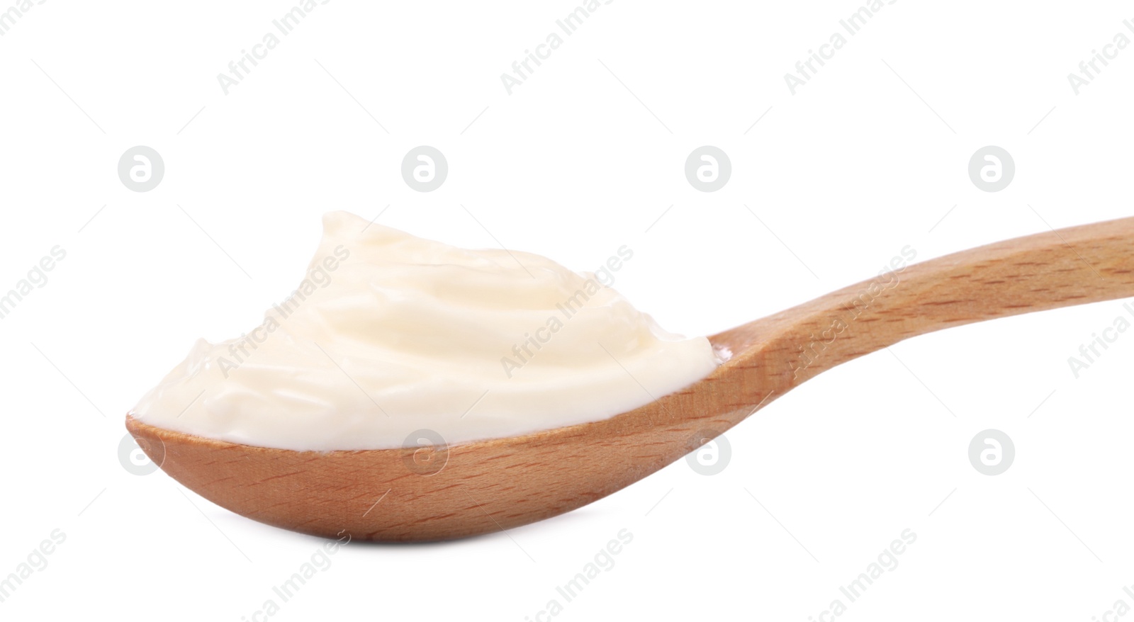 Photo of Delicious sour cream in wooden spoon on white background