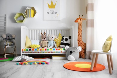 Photo of Baby room interior with stylish furniture and toys