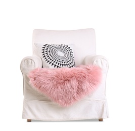 Comfortable armchair with pillow on white background. Interior element