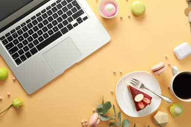 Photo of Flat lay composition with laptop on beige background. Food blogger's workplace