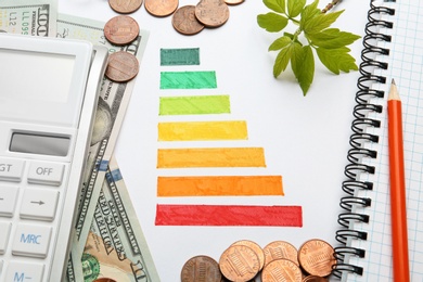 Photo of Flat lay composition with colorful chart and calculator on white background. Energy efficiency concept