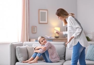 Mother arguing with daughter at home