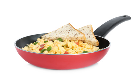 Photo of Tasty scrambled eggs with sprouts, cherry tomato and bread in frying pan isolated on white