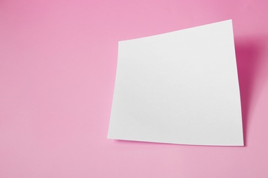 Photo of Empty sheet on pink background. Mockup for design