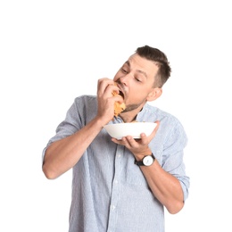 Photo of Man eating potato chips on white background