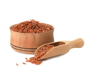 Photo of Bowl and scoop with uncooked red rice on white background