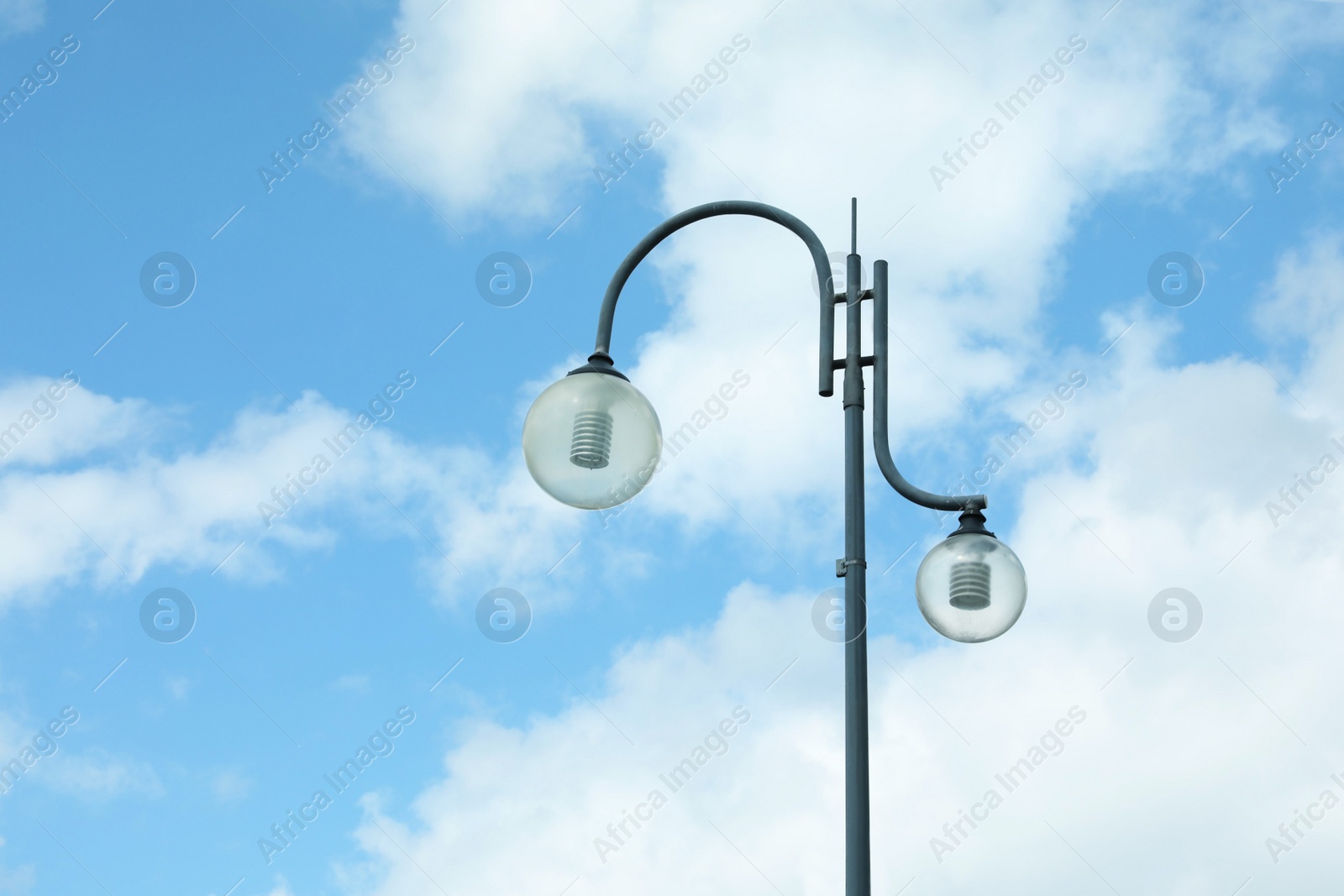 Photo of Beautiful street lamp with glass globes outdoors on sunny day. Space for text