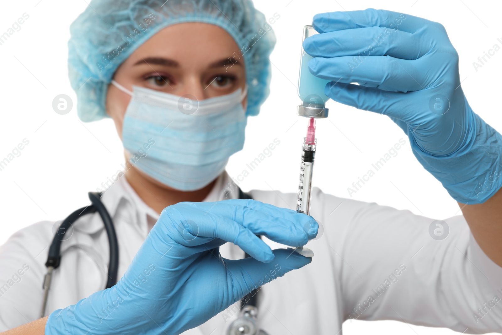 Photo of Doctor filling syringe with medication from glass vial on white background, selective focus