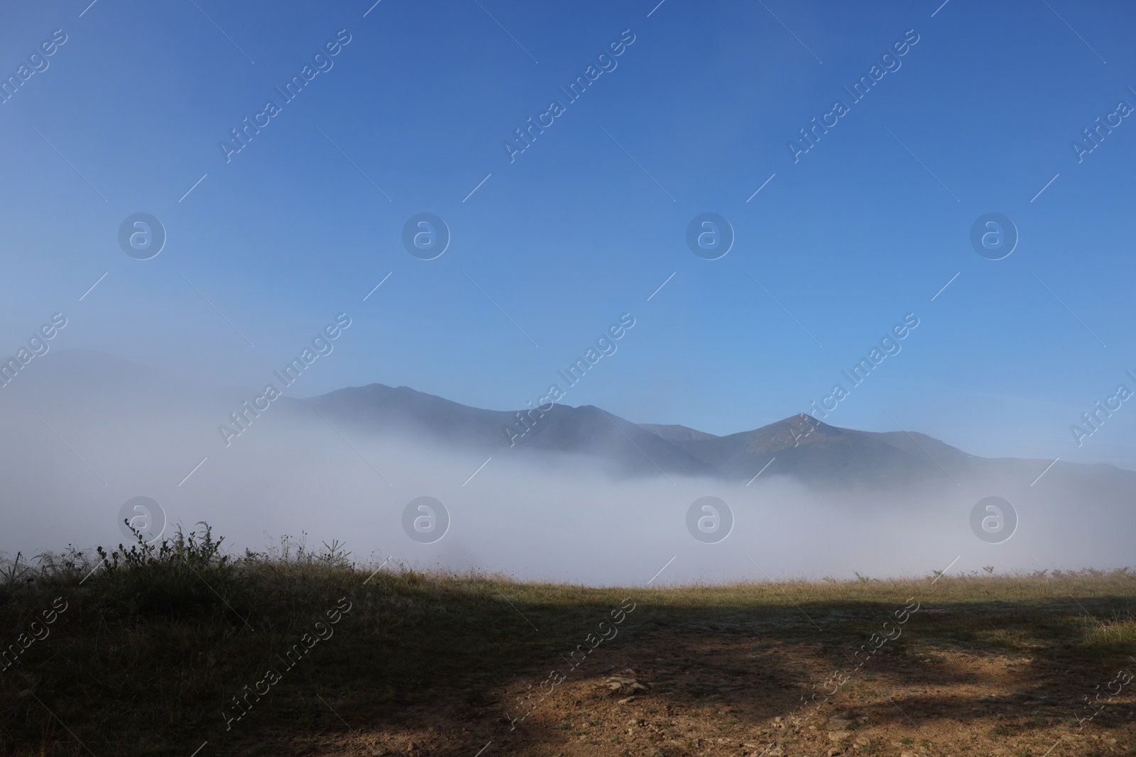 Photo of Beautiful view of landscape with foggy mountain hills