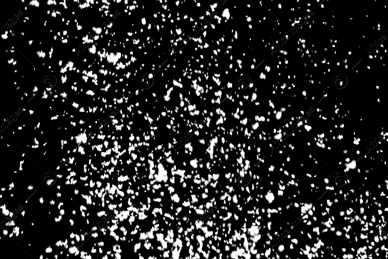 Photo of White snow falling down on black background