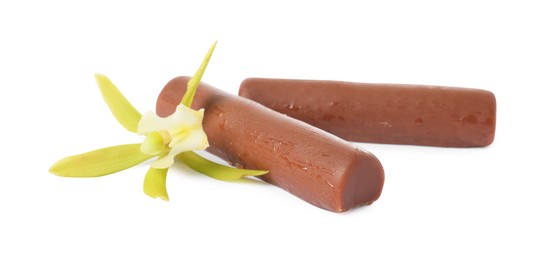 Photo of Glazed curd cheese bars and vanilla flower isolated on white