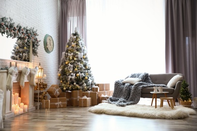 Photo of Stylish interior of living room with decorated Christmas tree