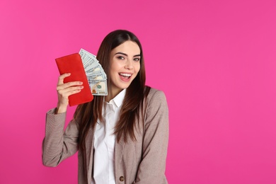 Photo of Businesswoman with money in wallet on color background. Space for text