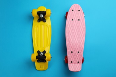 Photo of Skateboards on light blue background, flat lay