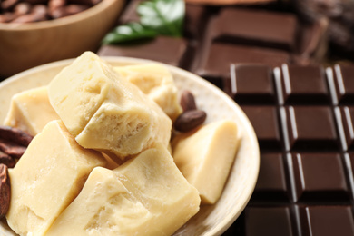 Aromatic organic cocoa butter on table, closeup