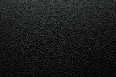 Photo of Texture of black leather as background, closeup