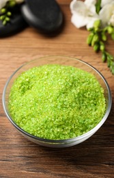 Photo of Aromatic sea salt on wooden table, closeup