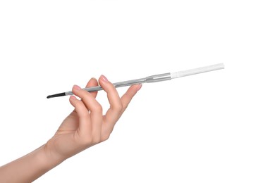 Photo of Woman holding long cigarette holder isolated on white, closeup