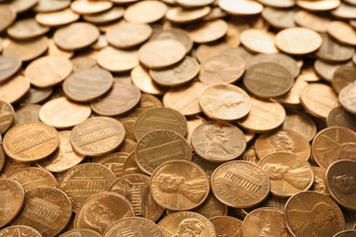 Photo of Pile of shiny USA one cent coins as background