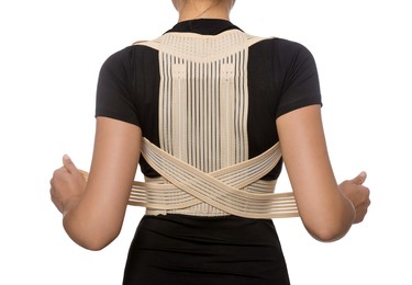 Photo of Closeup of woman with orthopedic corset on white background, back view