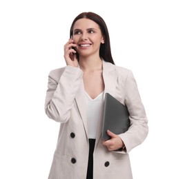 Photo of Beautiful businesswoman in suit with laptop talking on smartphone against white background