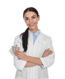 Photo of Professional pharmacist with pills on white background