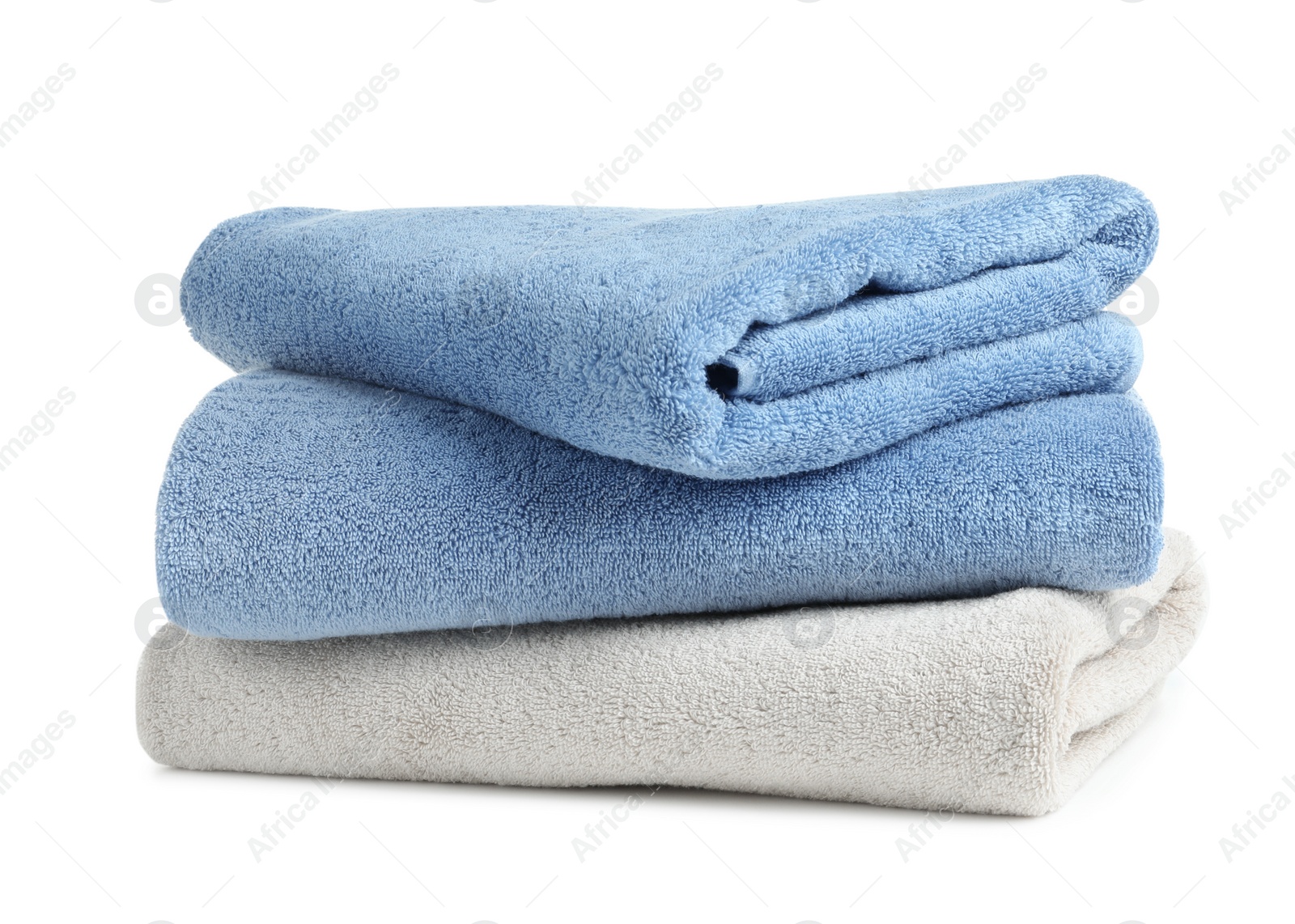 Photo of Stack of clean soft towels on white background