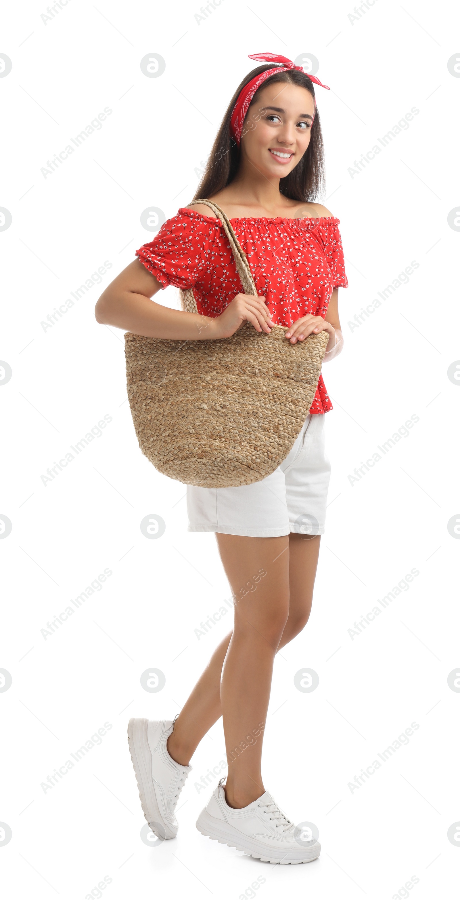 Photo of Young woman with stylish straw bag on white background